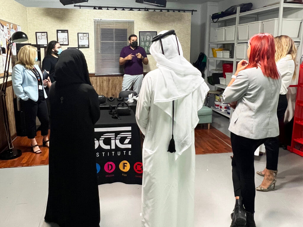 a group of Emirati attending an augmented and virtual reality instructor's speech