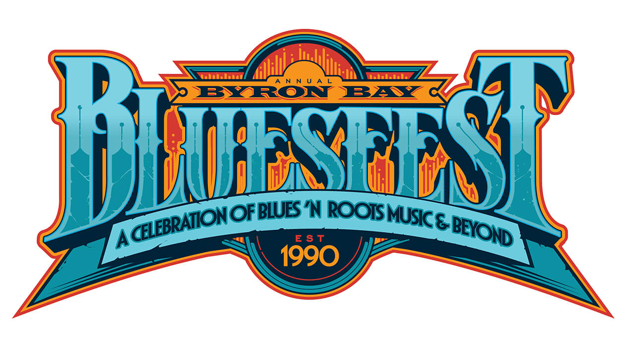 Byron Bay Bluesfest logo since 1990. Text reads: Annual Byron Bay Bluesfest. A celebration of blues'n roots music & beyond. Est 1990.